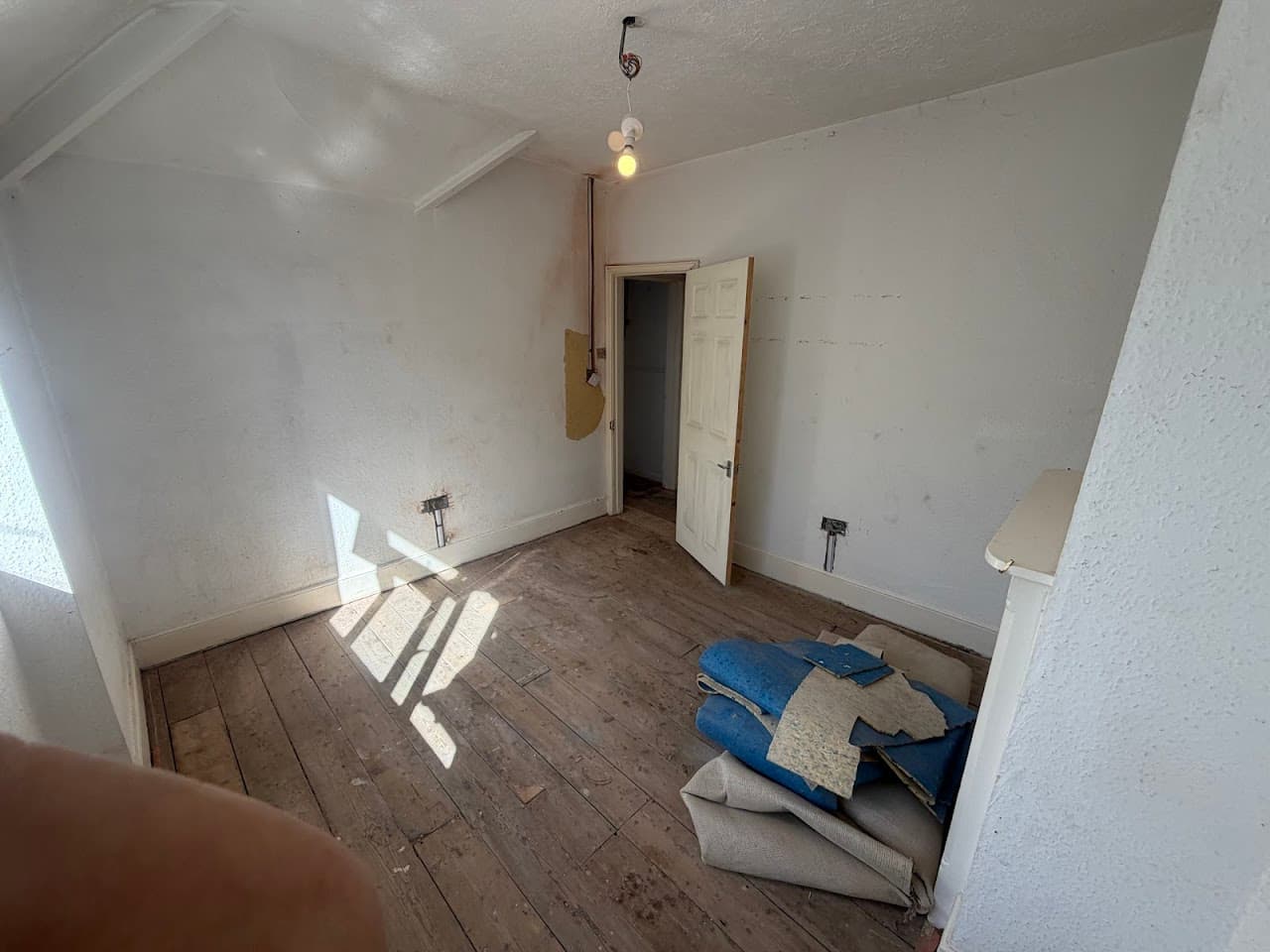 Recessed LED downlights fitted across a newly decorated room