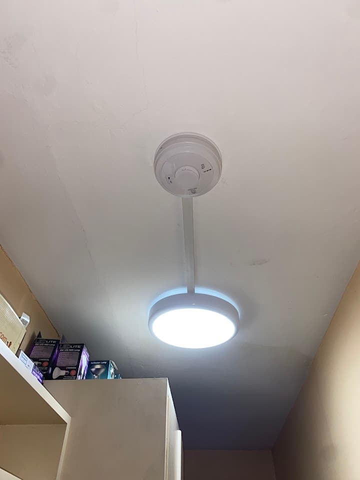 Flush LED ceiling light installed in a freshly plastered room